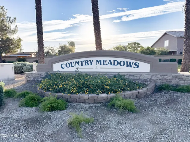 a sign broad in front of a road
