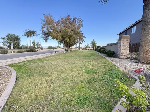 a view of backyard with outdoor and green space