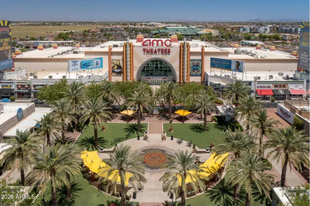 an aerial view of a house with a yard and lake view