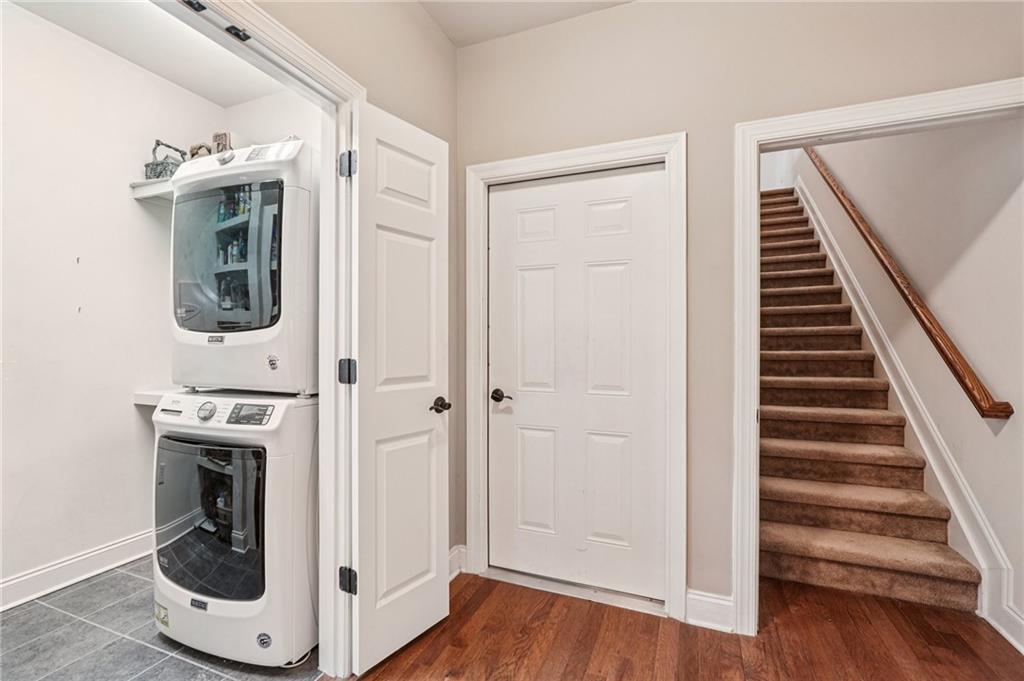 4334 Lanier Ridge Walk, Unit 1403 Cumming, GA 30041 - Photo 17 of 29 a view of a hallway with wooden floor and staircase