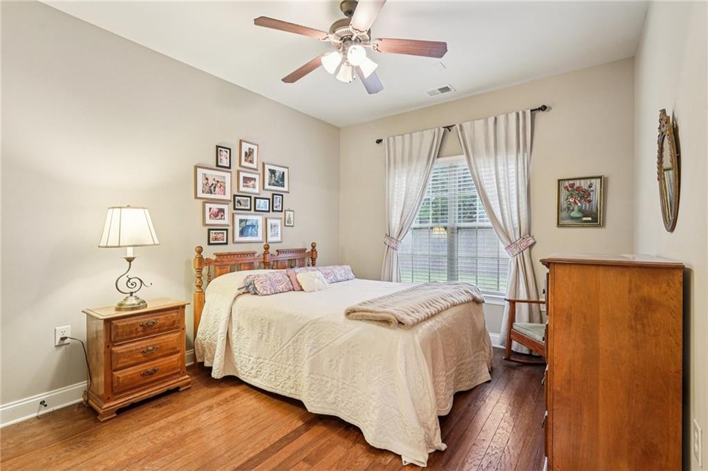 4334 Lanier Ridge Walk, Unit 1403 Cumming, GA 30041 - Photo 18 of 29 a bedroom with a bed and a window