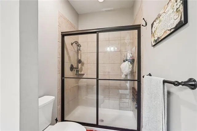a bathroom with a glass shower door