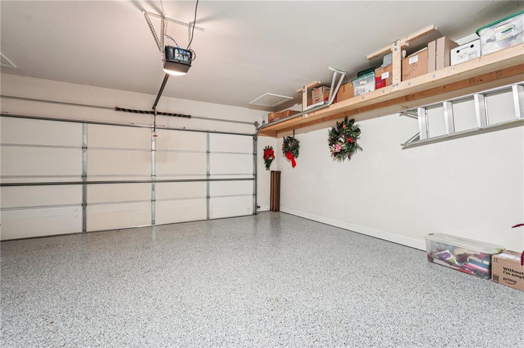 4334 Lanier Ridge Walk, Unit 1403 Cumming, GA 30041 - Photo 25 of 29 a view of a garage with shelf