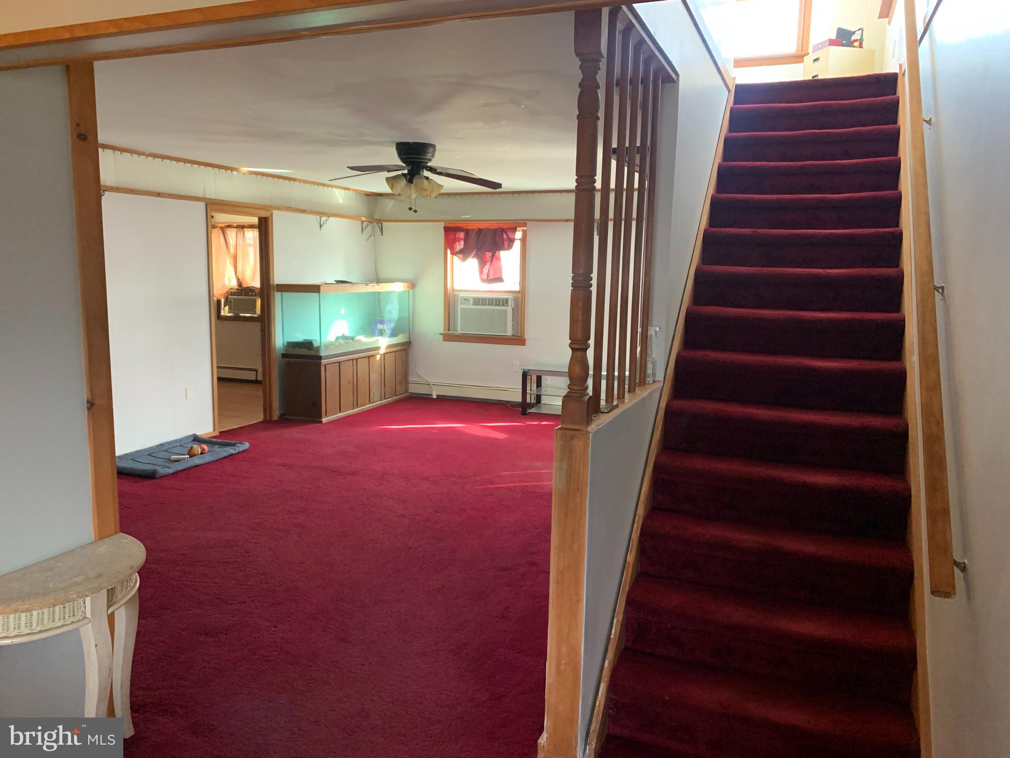 16 Spring Lane Levittown, PA 19055 - Photo 3 of 15 Front entry into living room and upstairs to upper
