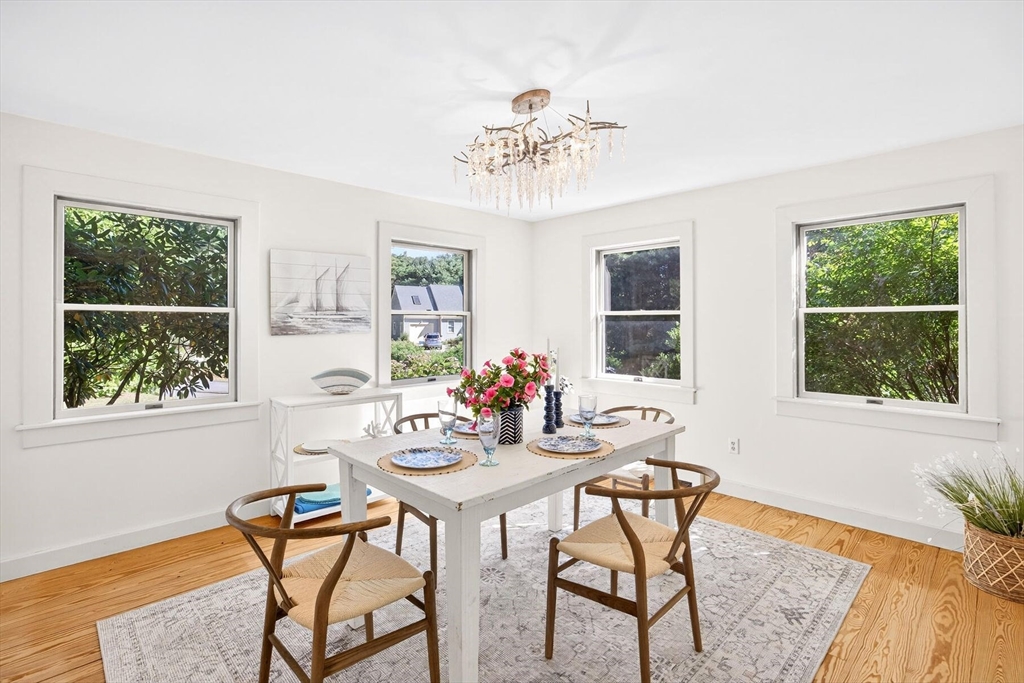 80 Log Cabin Road Eastham, MA 02642 - Photo 15 of 41 a view of a dining room with furniture window and outside view