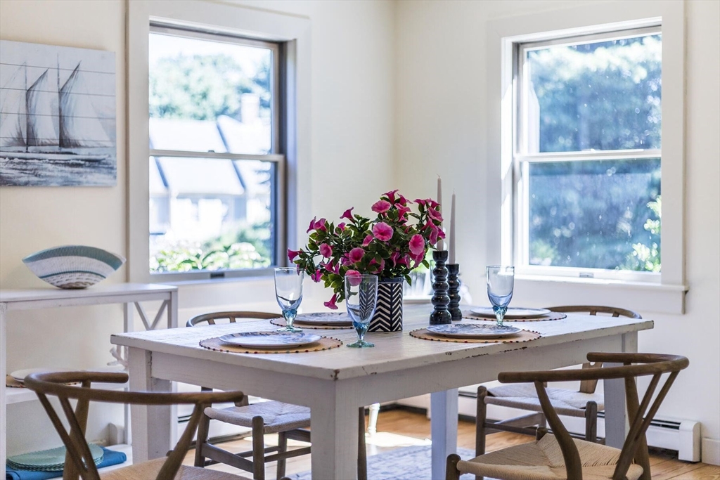 80 Log Cabin Road Eastham, MA 02642 - Photo 17 of 41 a view of a dining room with furniture window and outside view