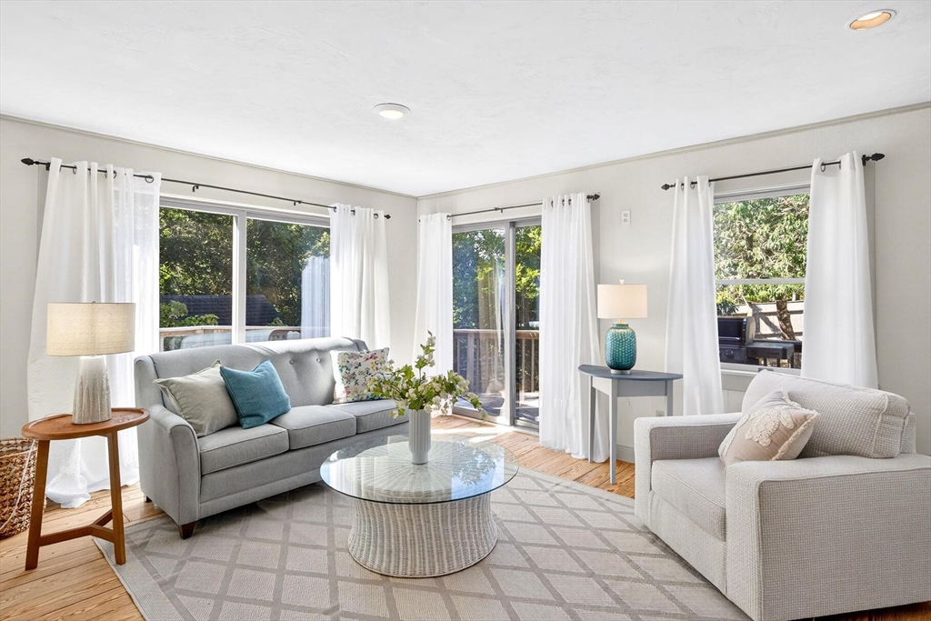 80 Log Cabin Road Eastham, MA 02642 - Photo 19 of 41 a living room with furniture and a large window