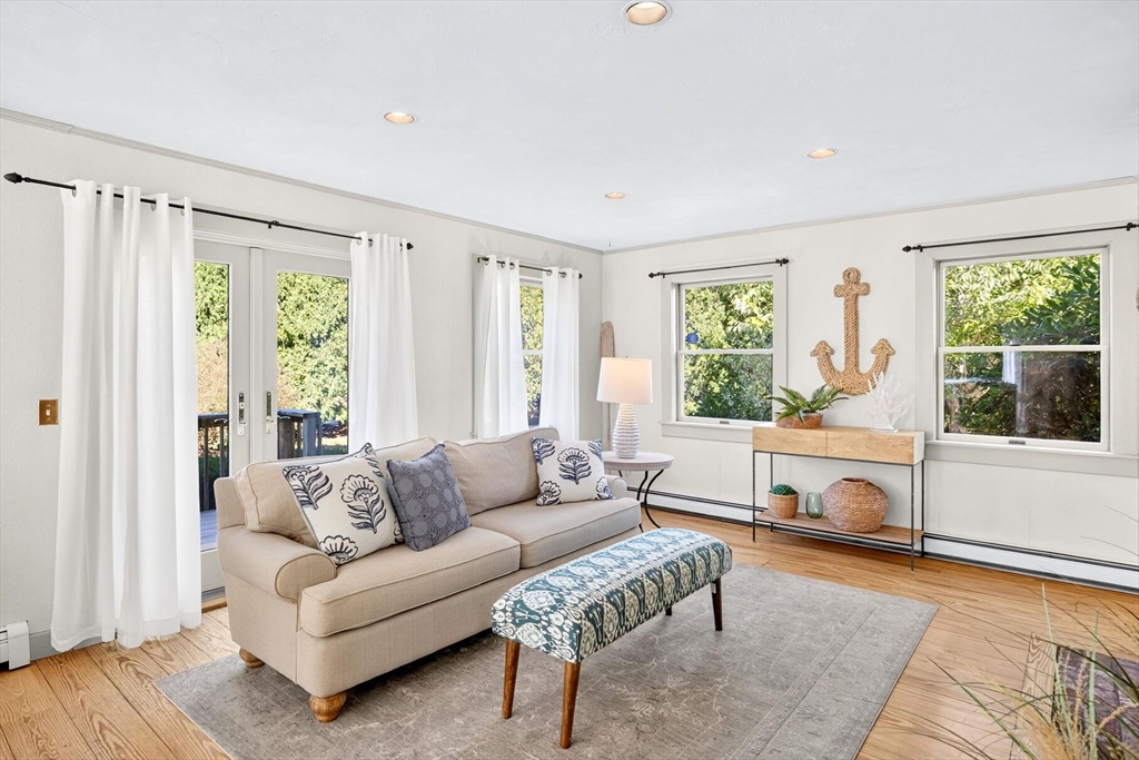80 Log Cabin Road Eastham, MA 02642 - Photo 20 of 41 a living room with furniture and a large window
