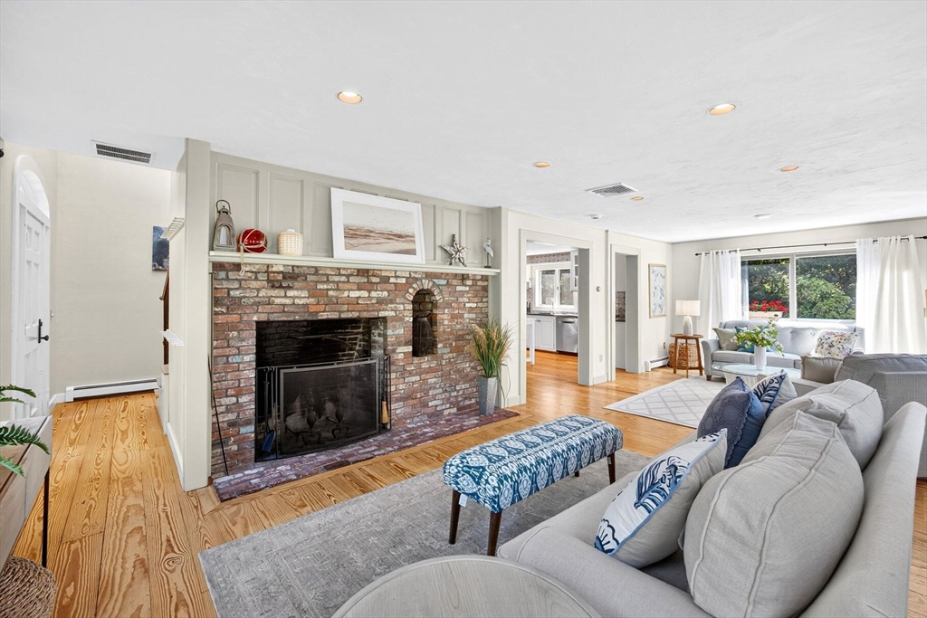 80 Log Cabin Road Eastham, MA 02642 - Photo 27 of 41 a living room with furniture and a fireplace