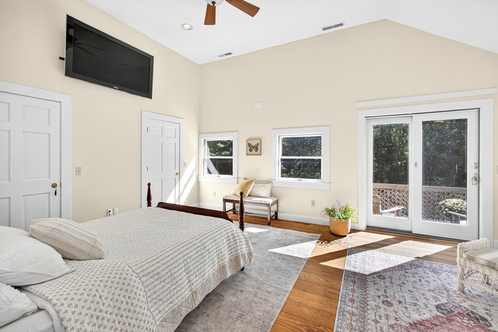 80 Log Cabin Road Eastham, MA 02642 - Photo 29 of 41 a bedroom with a bed and large window