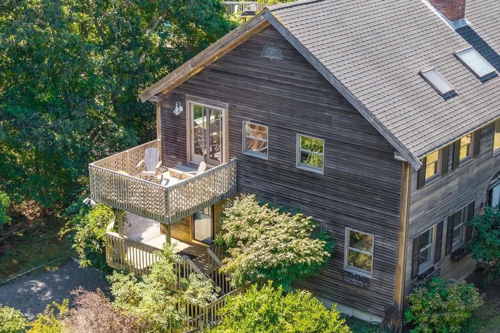 80 Log Cabin Road Eastham, MA 02642 - Photo 30 of 41 a front view of a house with garden