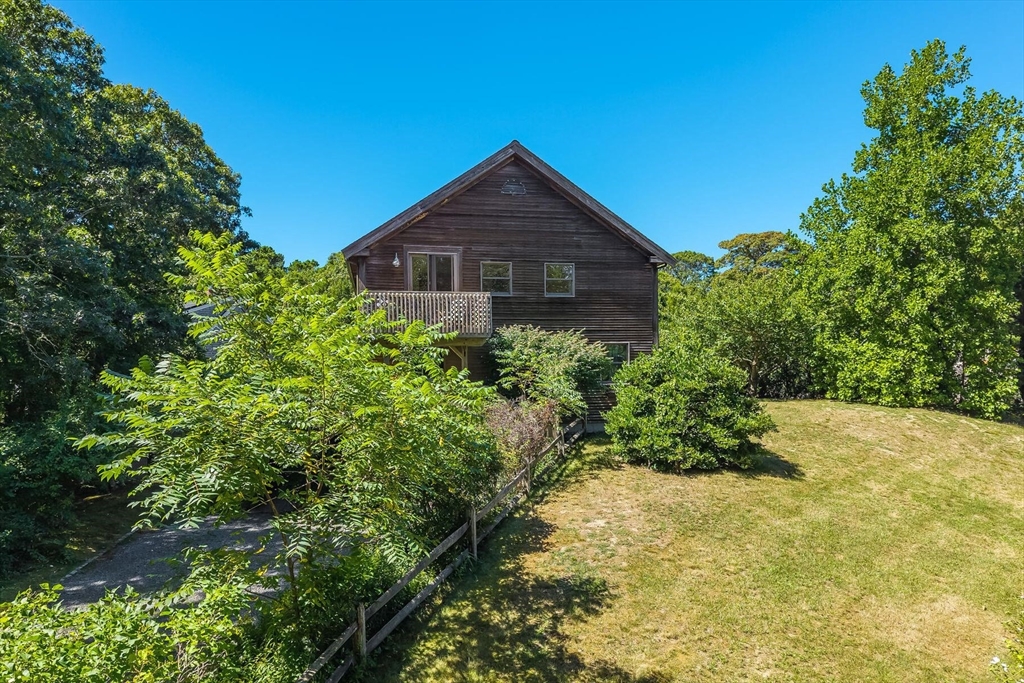 80 Log Cabin Road Eastham, MA 02642 - Photo 3 of 41 a view of a house with a yard