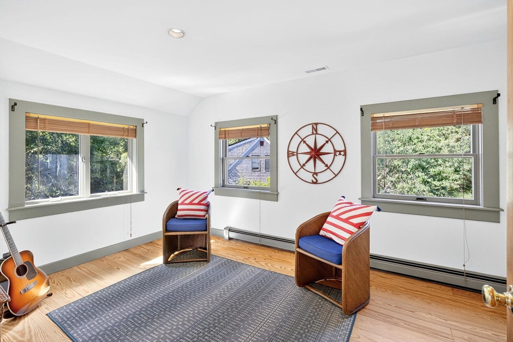 80 Log Cabin Road Eastham, MA 02642 - Photo 36 of 41 a living room with furniture and a window