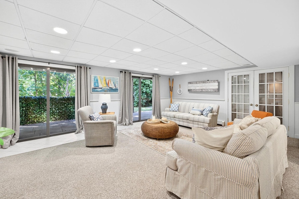 80 Log Cabin Road Eastham, MA 02642 - Photo 37 of 41 a living room with furniture and a large window