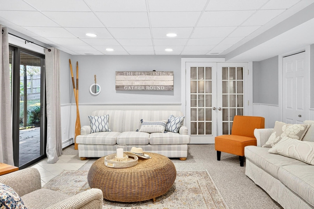 80 Log Cabin Road Eastham, MA 02642 - Photo 38 of 41 a living room with furniture and a large window