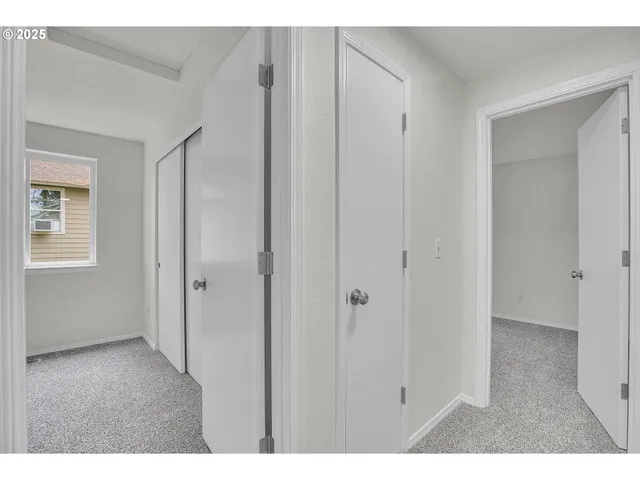 a room with closet and wooden floor