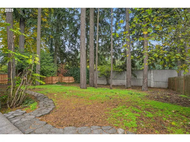 a backyard of a house with lots of green space