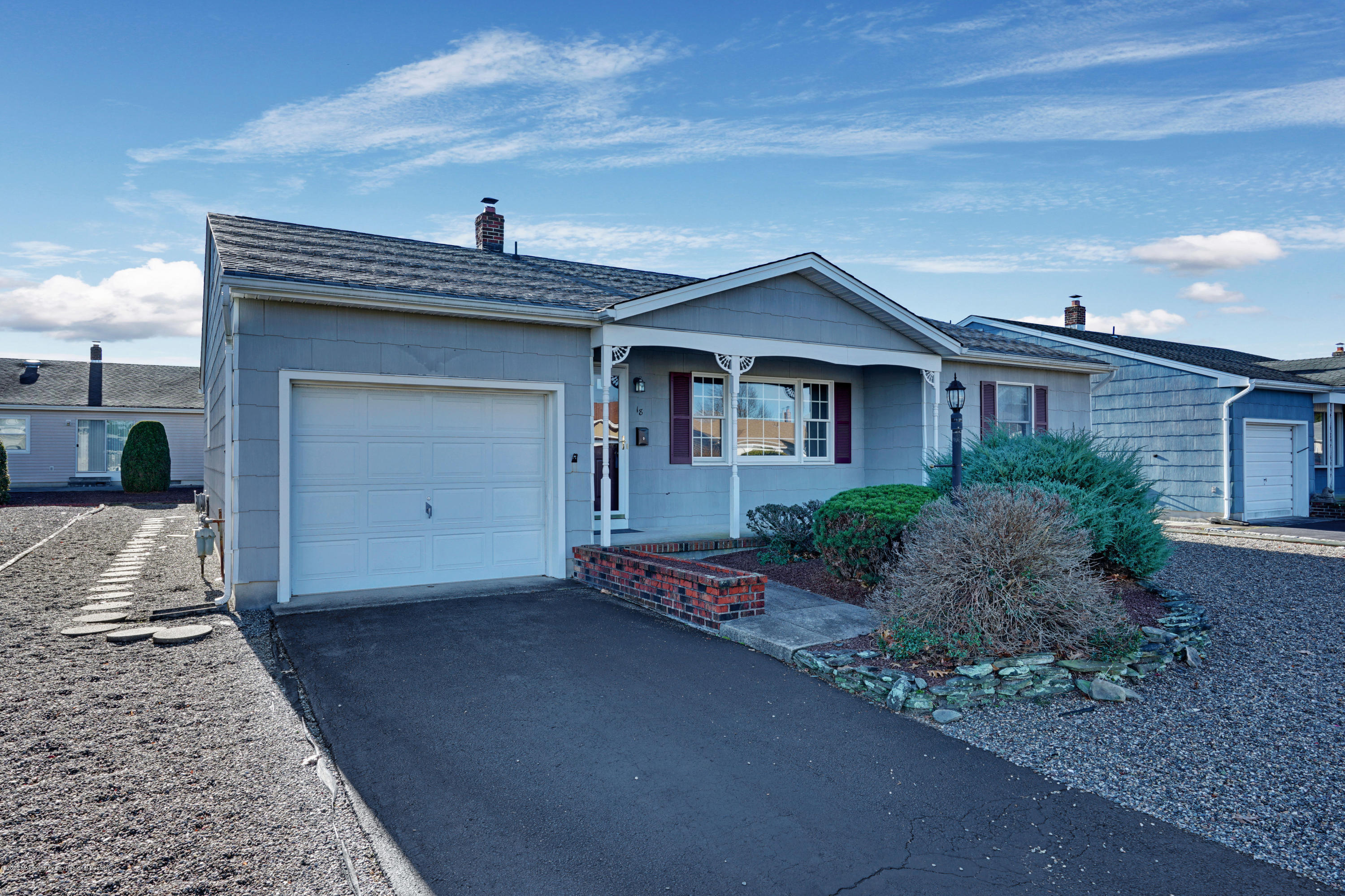 18 Mapleton Road Toms River, NJ 08757 - Photo 2 of 18 a front view of a house with garden