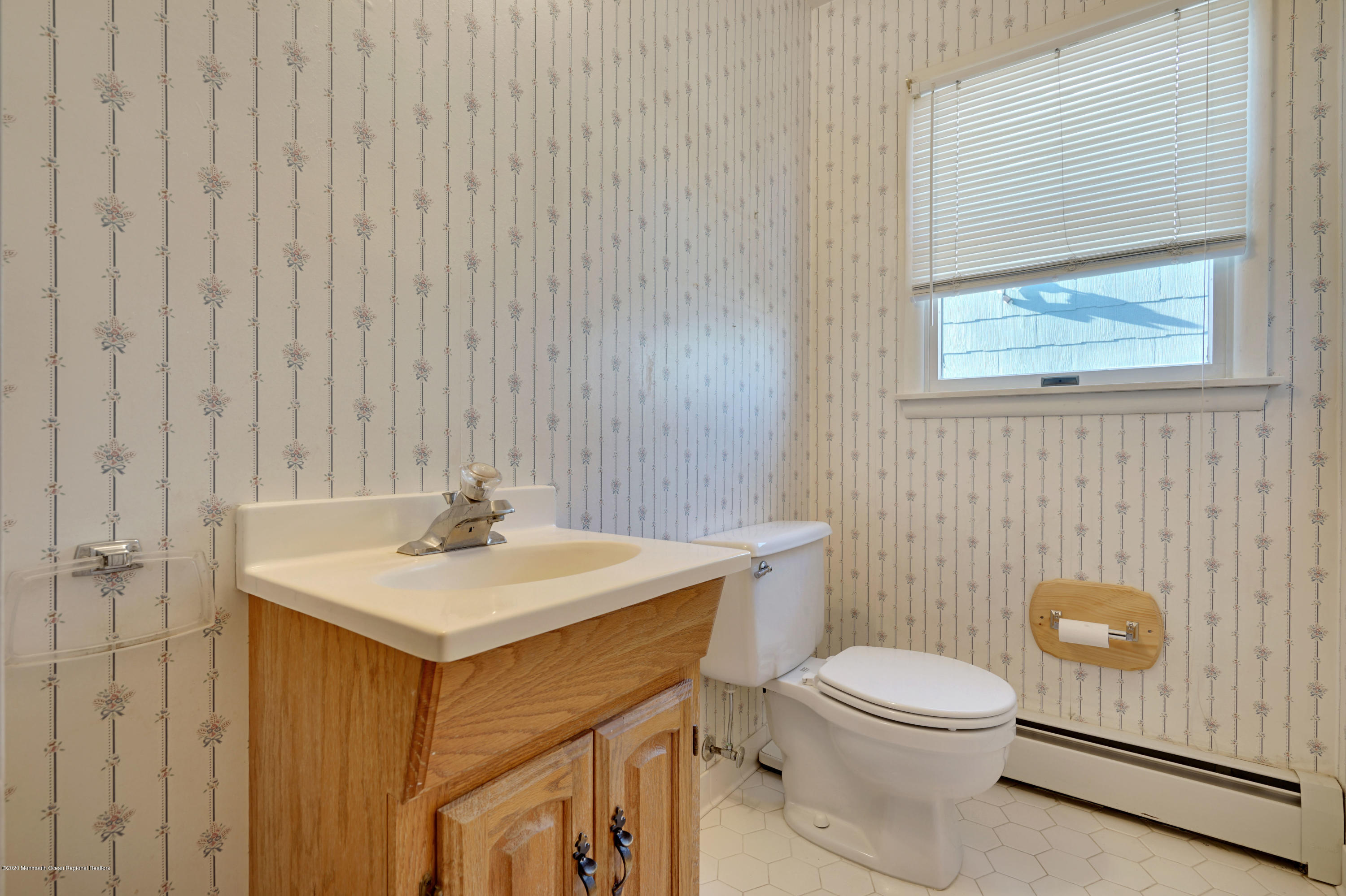 18 Mapleton Road Toms River, NJ 08757 - Photo 13 of 18 a bathroom with a toilet a sink and a mirror