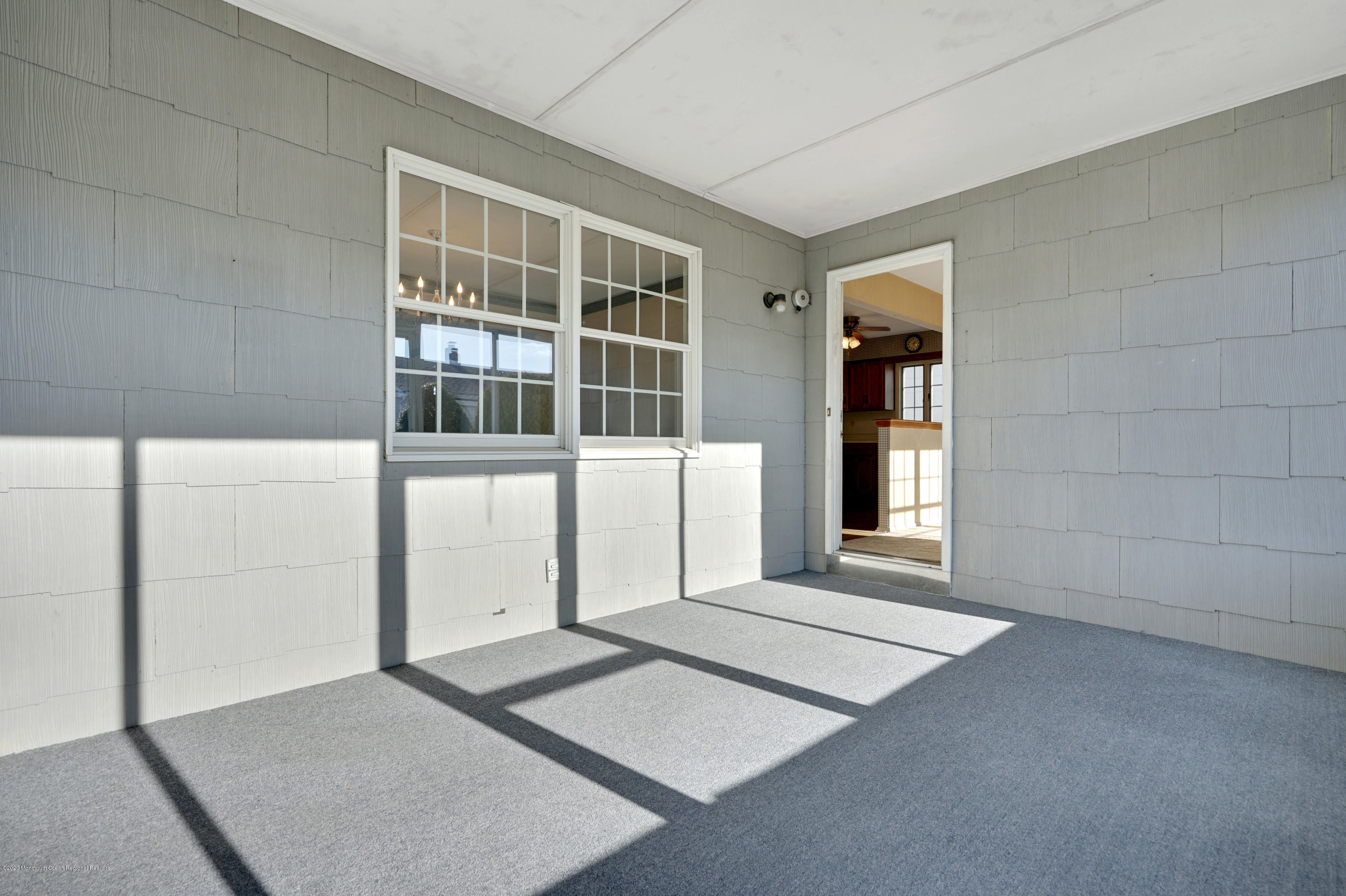 18 Mapleton Road Toms River, NJ 08757 - Photo 18 of 18 a view of an empty room with wooden floor and a window