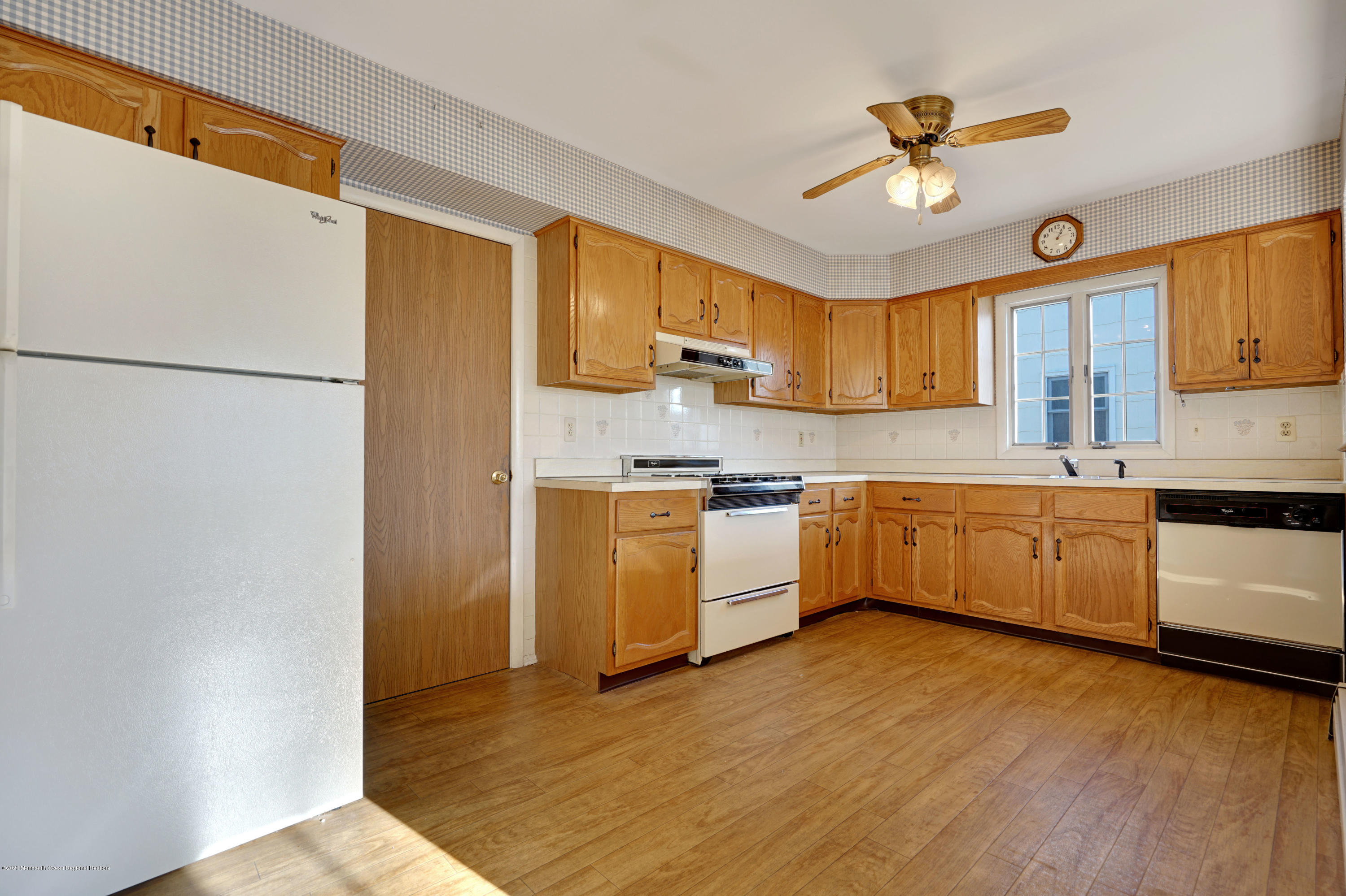 18 Mapleton Road Toms River, NJ 08757 - Photo 6 of 18 a kitchen with a cabinets a sink stainless steel appliances and a window