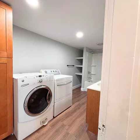 a view of a kitchen with a washer and dryer