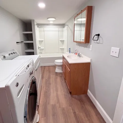 a view of a kitchen with washer and dryer