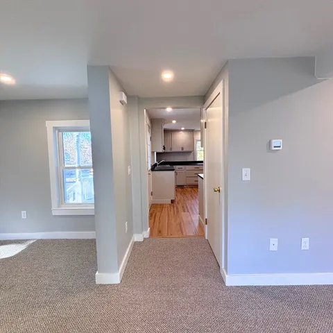 a view of a kitchen and a window