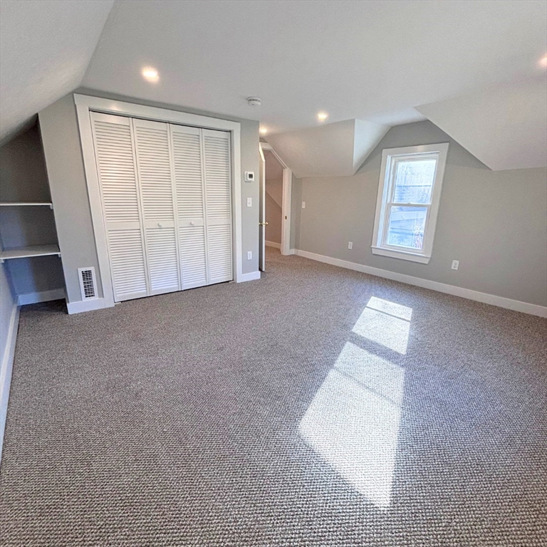 301 Central Street Hudson, MA 01749 - Photo 25 of 33 an empty room with windows and closet