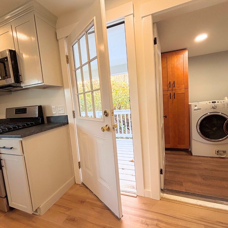 301 Central Street Hudson, MA 01749 - Photo 8 of 33 a view of a storage and utility room with wooden floor