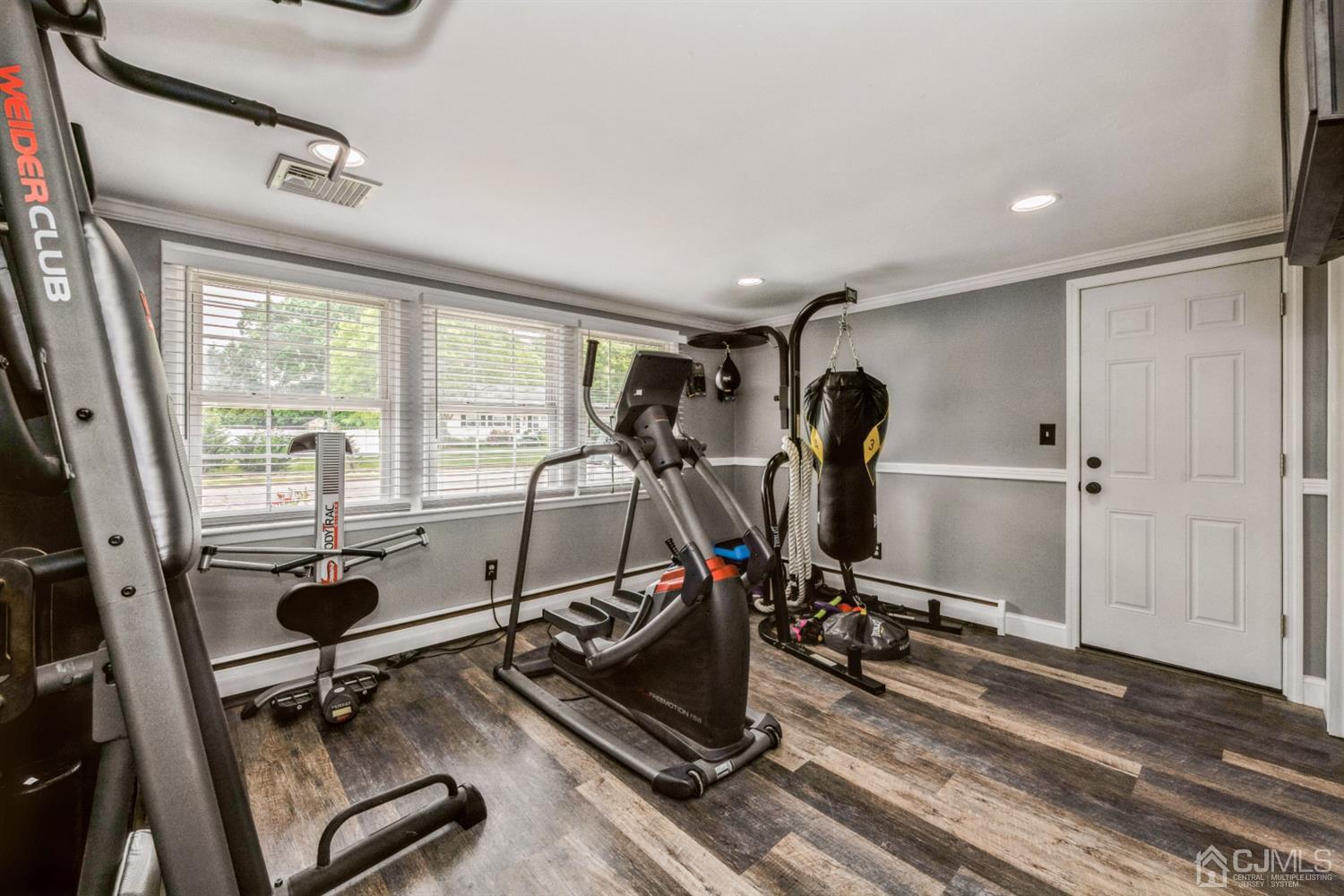 1341 Seneca Road North Brunswick, NJ 08902 - Photo 9 of 23 Den on first level being used as home gym