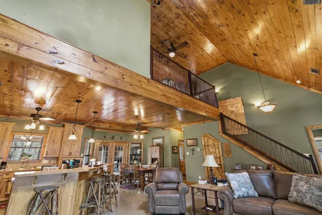 a view of a hallway with dining room and chandelier