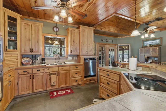 a large kitchen with cabinets and a stove