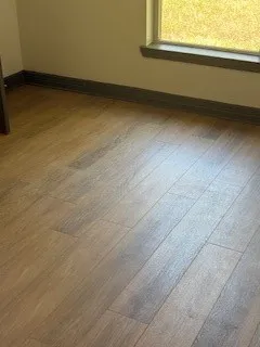 a view of an empty room and a window