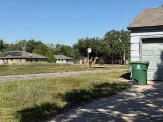 a view of a park with large trees