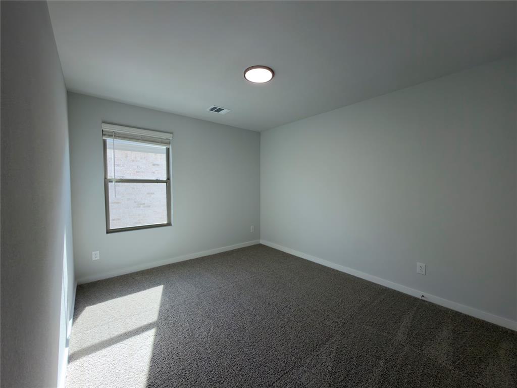 120 Millwood Road Lavon, TX 75166 - Photo 13 of 34 Room featuring light gray painted walls, a single window with blinds, and recessed ceiling lighting