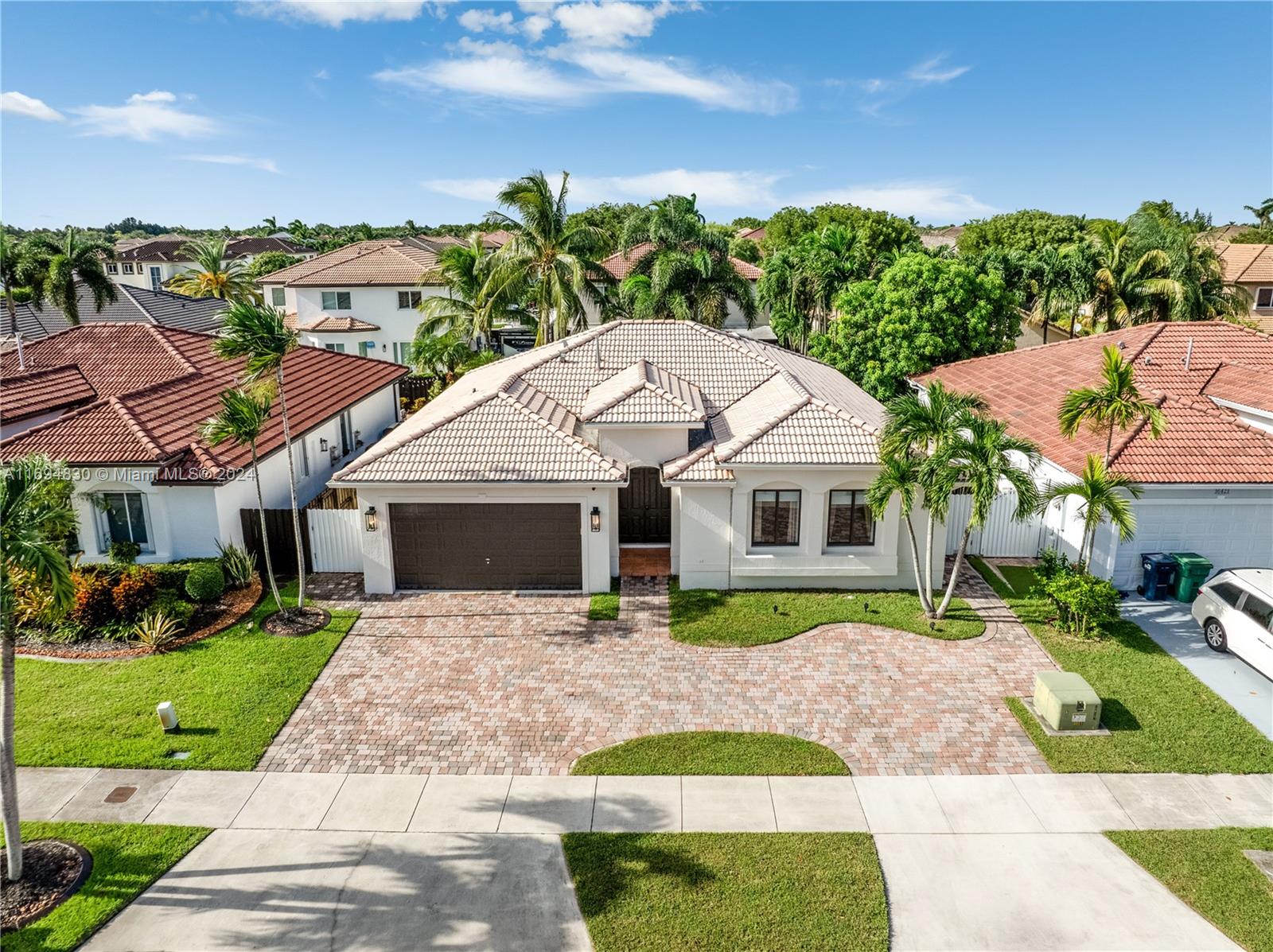 16429 Southwest 54th Terrace Miami, FL 33185 - Photo 3 of 28 a front view of a house with garden