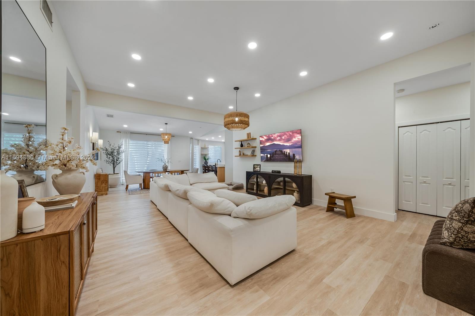 16429 Southwest 54th Terrace Miami, FL 33185 - Photo 5 of 28 a living room with furniture and a wooden floor