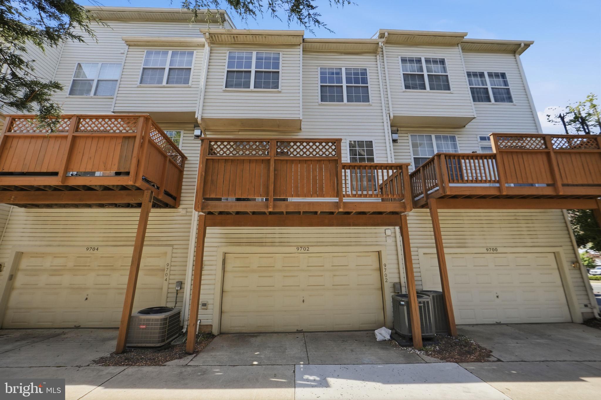 9702 Athletic Way Gaithersburg, MD 20878 - Photo 2 of 29 a front view of a house with parking