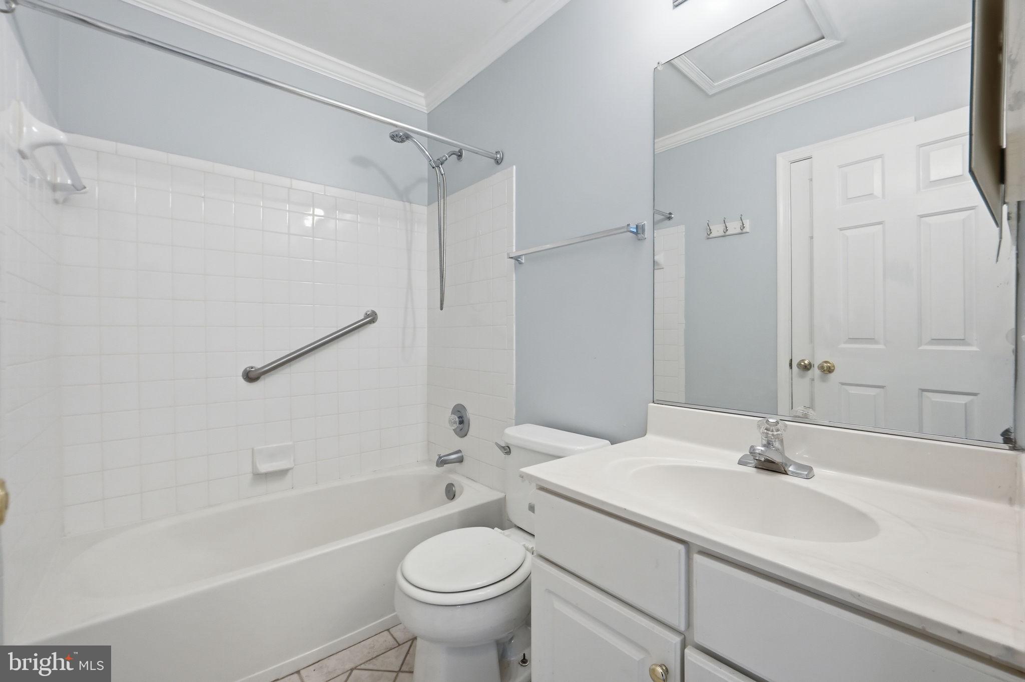 9702 Athletic Way Gaithersburg, MD 20878 - Photo 25 of 29 a bathroom with a sink toilet a mirror and shower