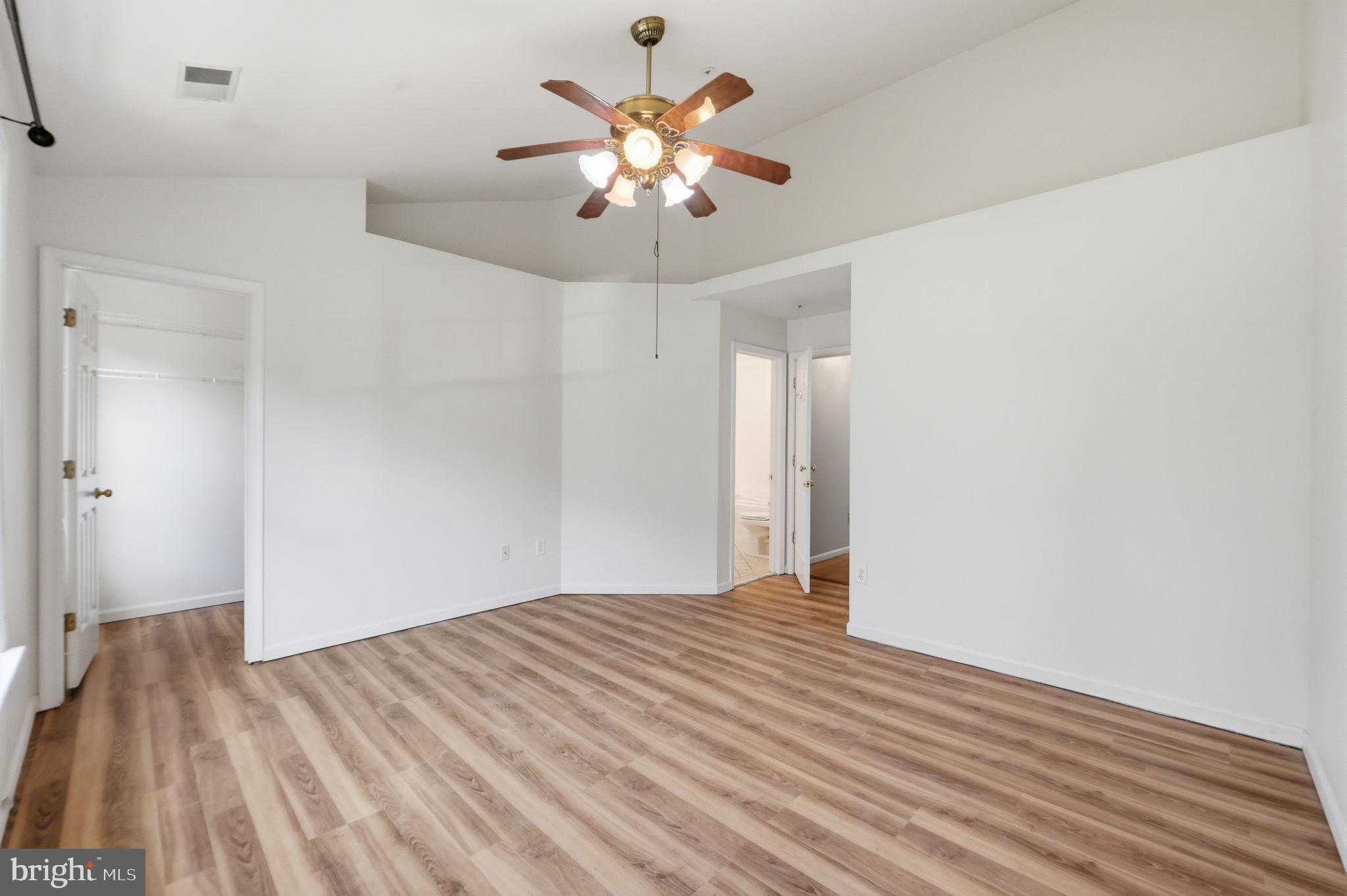 9702 Athletic Way Gaithersburg, MD 20878 - Photo 28 of 29 a view of an empty room with wooden floor