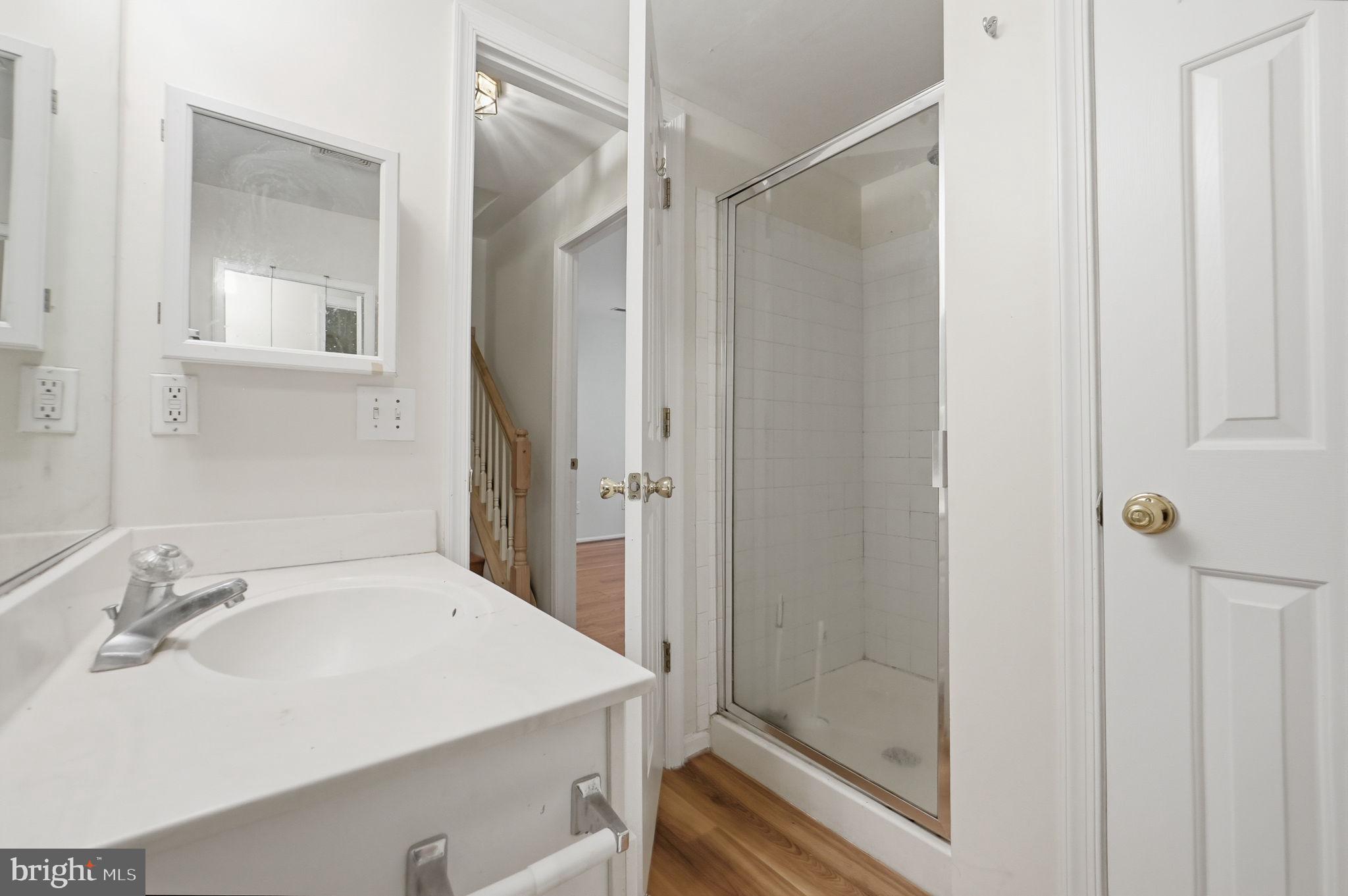 9702 Athletic Way Gaithersburg, MD 20878 - Photo 7 of 29 a bathroom with a sink and shower