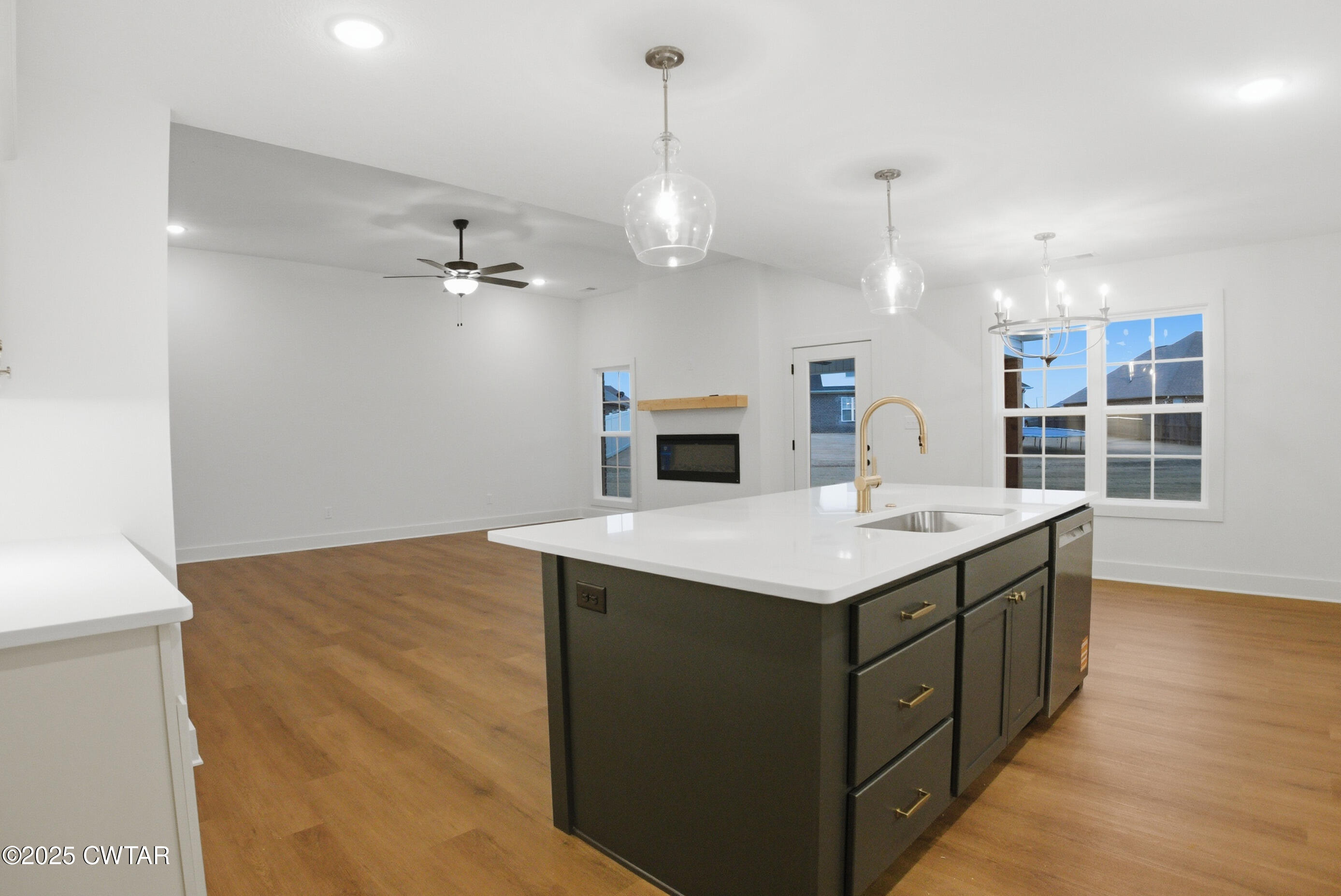 164 Daybreak Loop Medina, TN 38355 - Photo 14 of 40 a kitchen with a stove and a wooden floor
