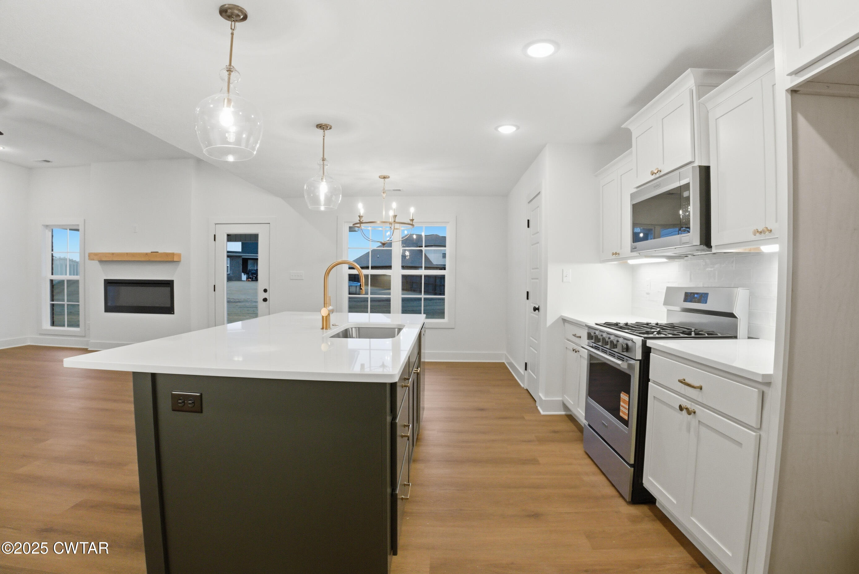 164 Daybreak Loop Medina, TN 38355 - Photo 17 of 40 a kitchen with kitchen island a sink stove and oven
