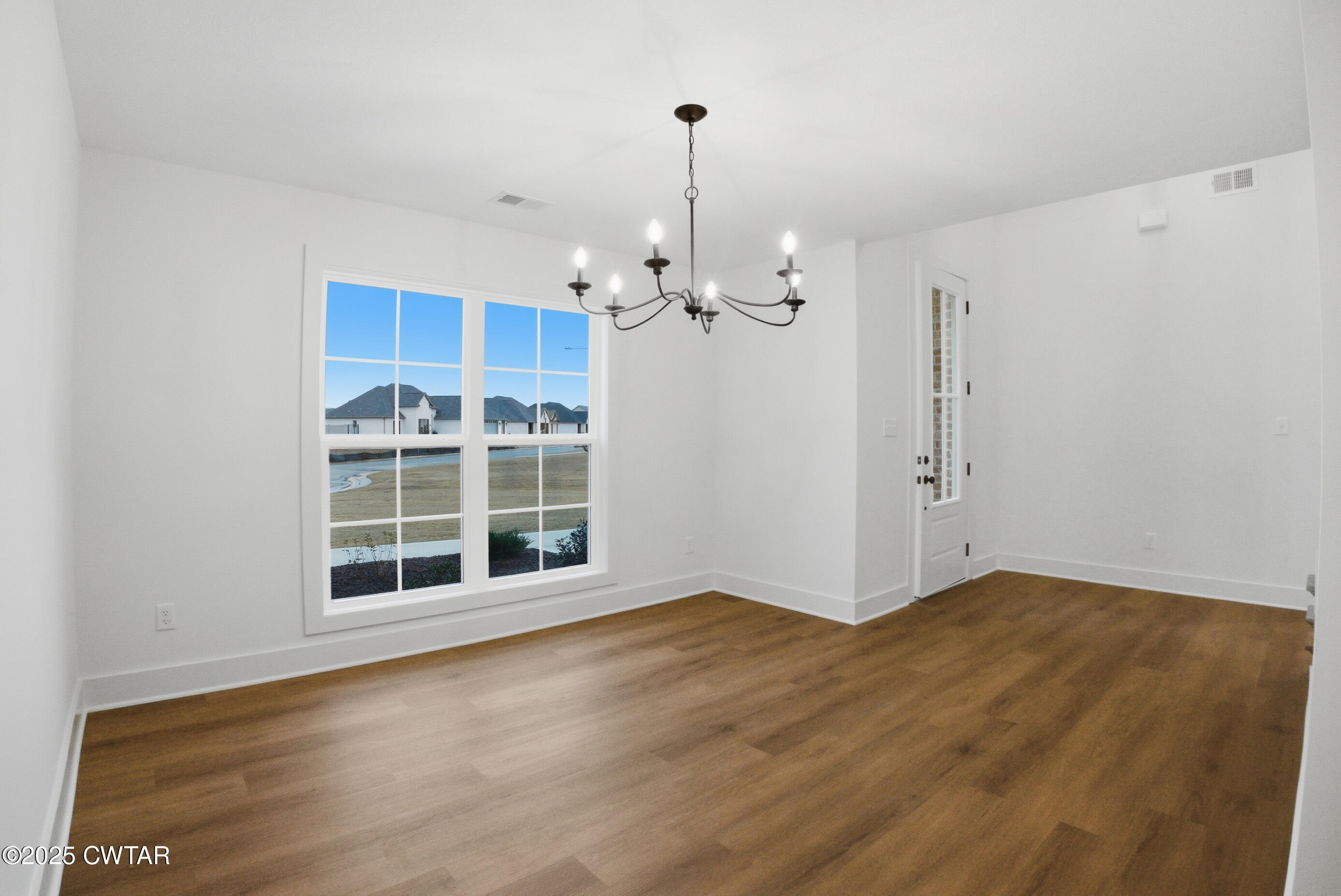 164 Daybreak Loop Medina, TN 38355 - Photo 19 of 40 a view of a room with wooden floor and window