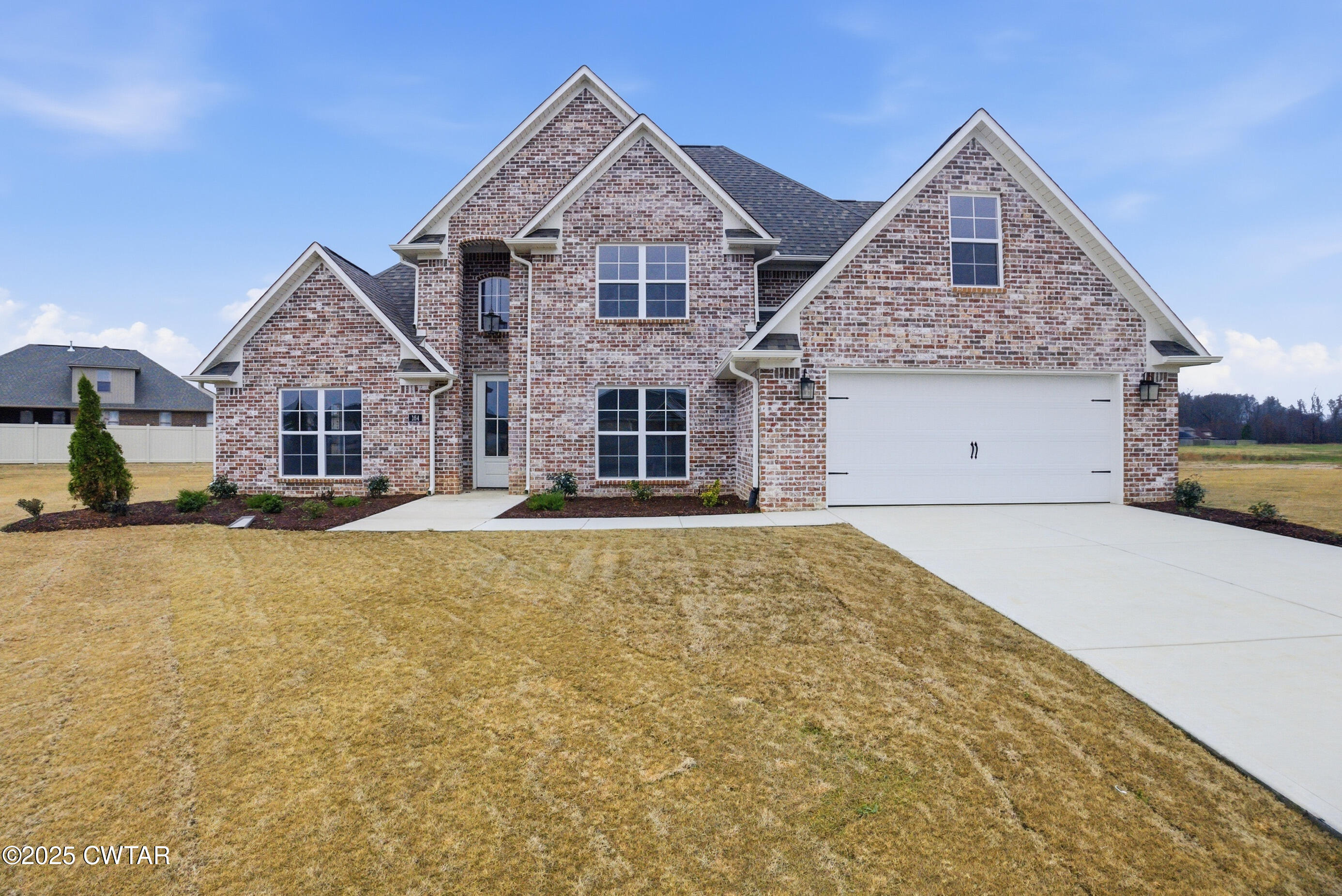 164 Daybreak Loop Medina, TN 38355 - Photo 2 of 40 a front view of a house with a yard