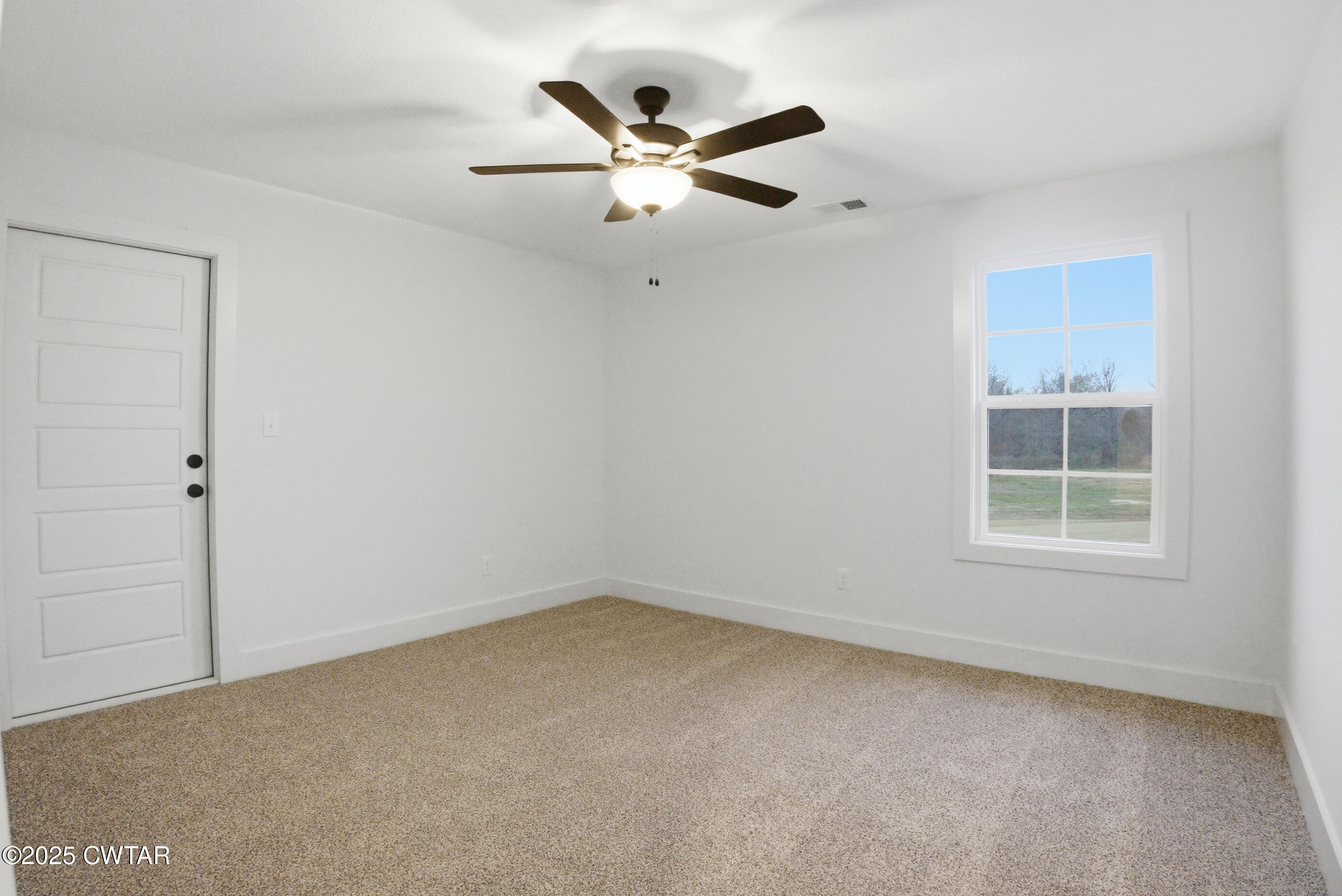 164 Daybreak Loop Medina, TN 38355 - Photo 33 of 40 an empty room with a ceiling fan and window