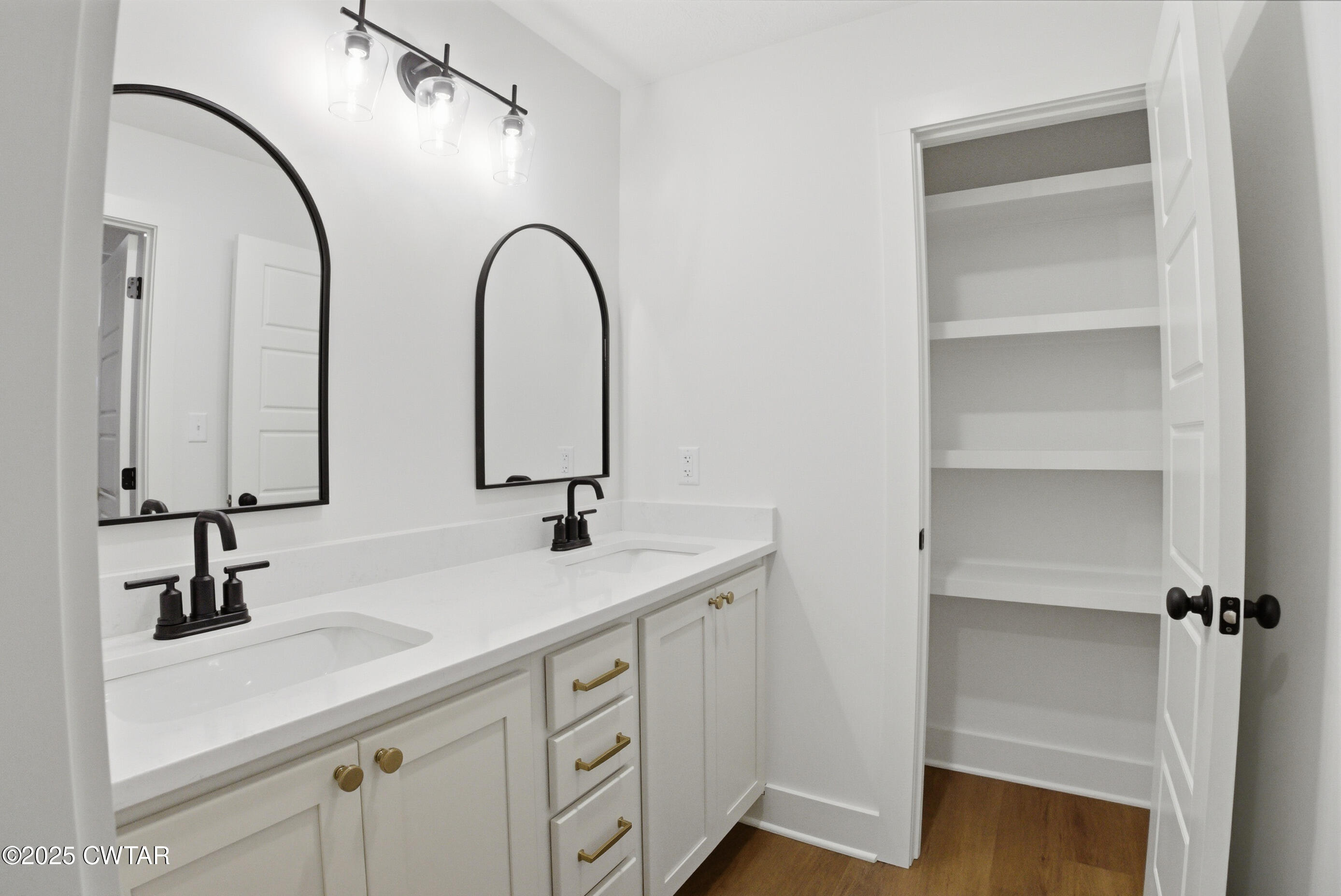 164 Daybreak Loop Medina, TN 38355 - Photo 34 of 40 a bathroom with a double vanity sink and a mirror