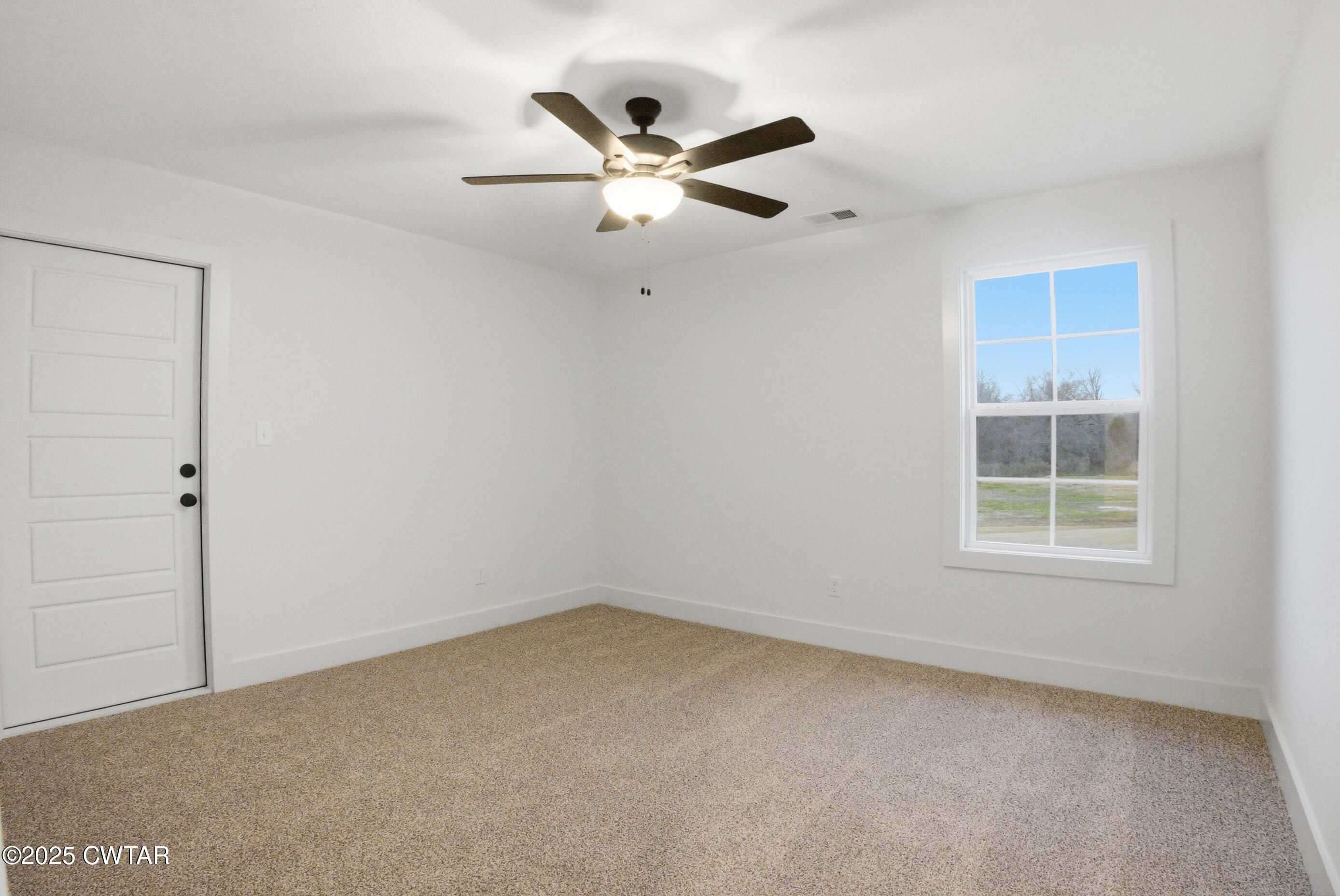 164 Daybreak Loop Medina, TN 38355 - Photo 35 of 40 an empty room with a window and a ceiling fan