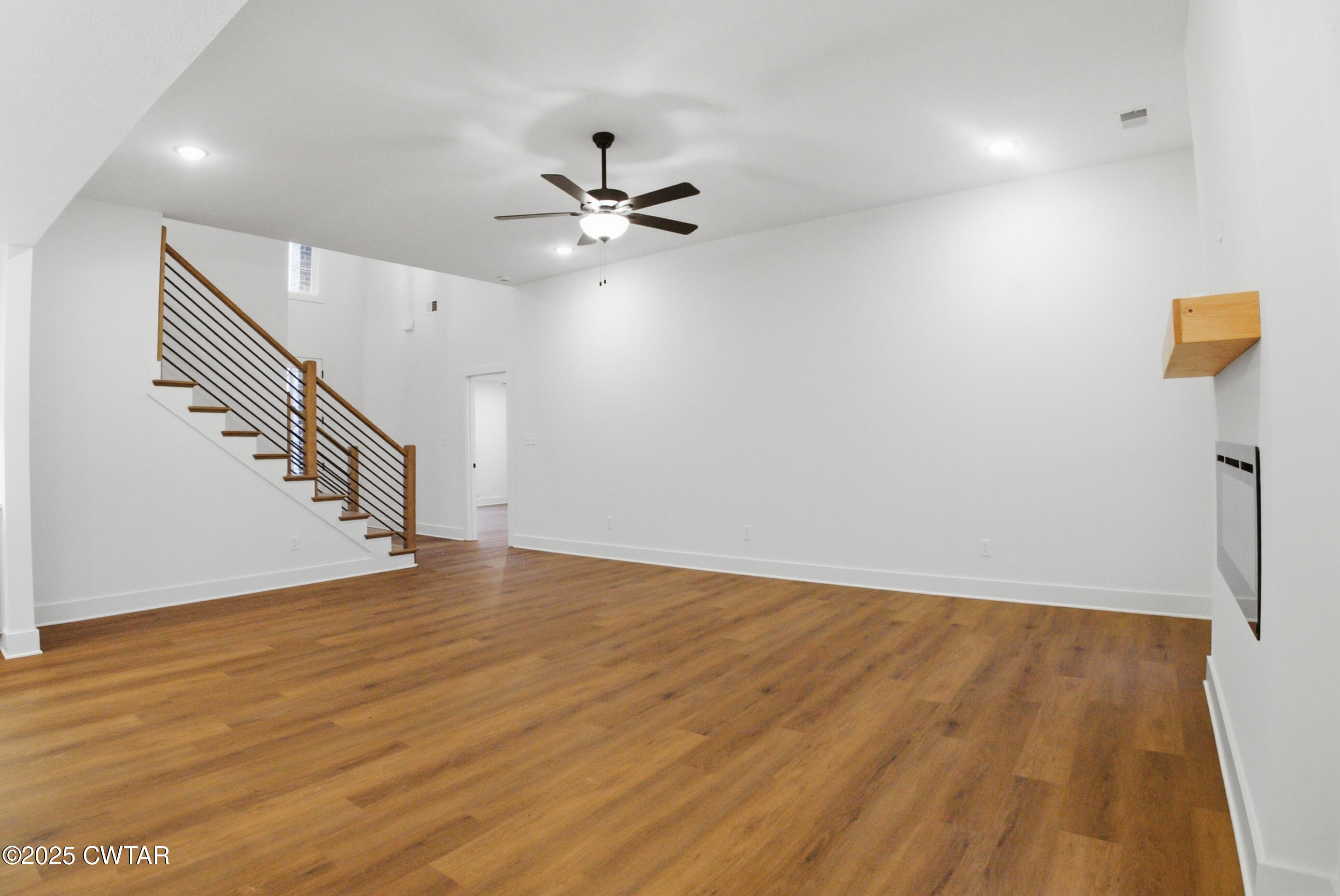 164 Daybreak Loop Medina, TN 38355 - Photo 6 of 40 a view of empty room with wooden floor and fan